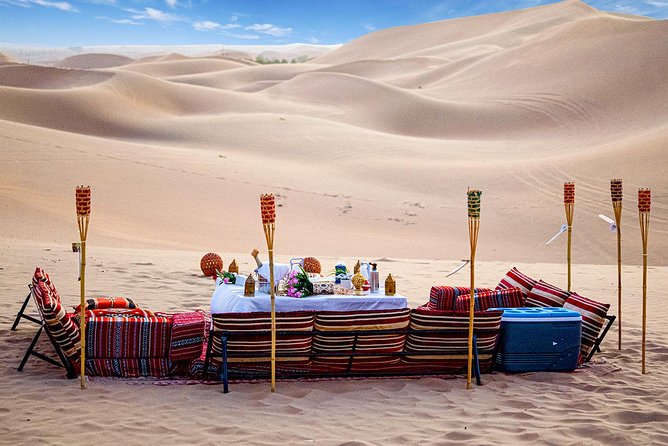 Abu Dhabi Private Desert Romantic Dune Dinner with Dune Bashing - Sandboarding, sand skiing, and Arabic dress