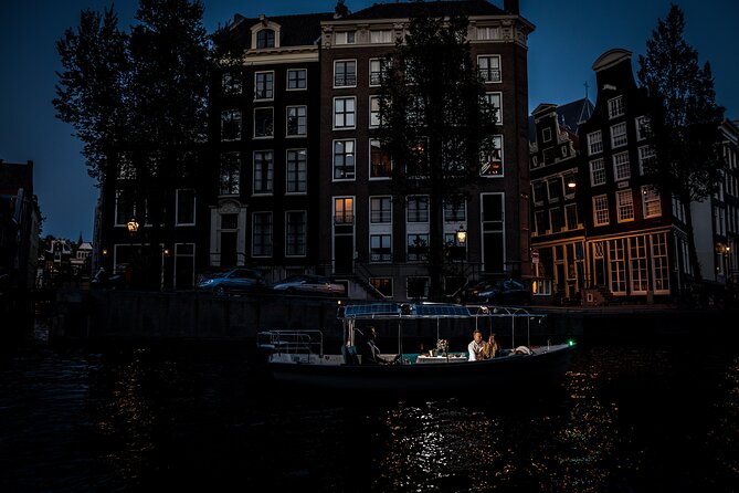 Amsterdam: Private Romantic Evening Canal Cruise + Bubbles/Snacks - Torensluis Bridge and old Amsterdam