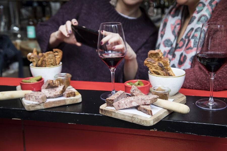 Barcelona Gourmet Food & Wine Tour with Local Expert - Second stop: comfort food, music, and a local bar feel