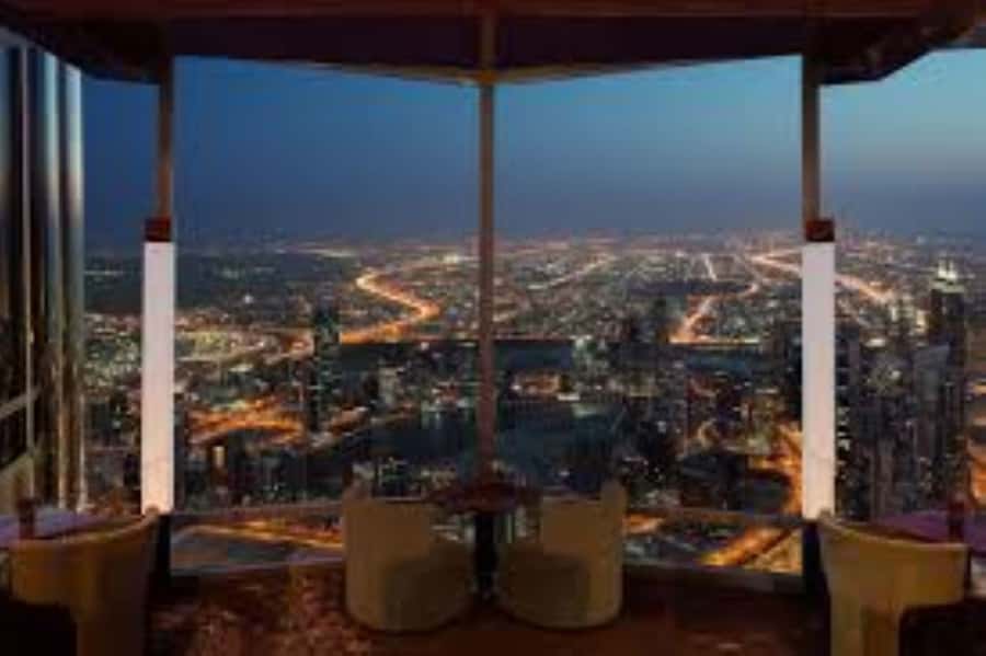 Dubai: Burj Khalifa Sunset Engagement with Porsche Pickup - The rose presentation at 500 meters