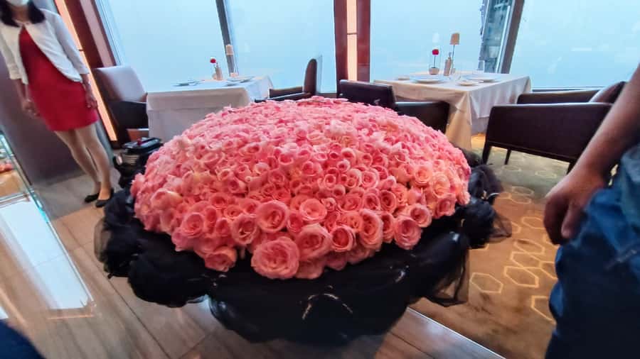 Dubai: Burj Khalifa Sunset Engagement with Porsche Pickup - Dinner and the Dubai Fountain setting