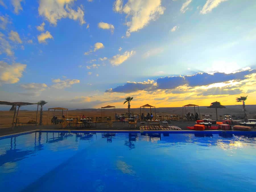 From Marrakech: Agafay Desert Sunset Dinner with Live Show - Mint tea and sunset over rocky Agafay