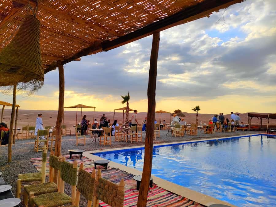 From Marrakech: Agafay Desert Sunset Dinner with Live Show - Camel rides and quad biking: what is included?
