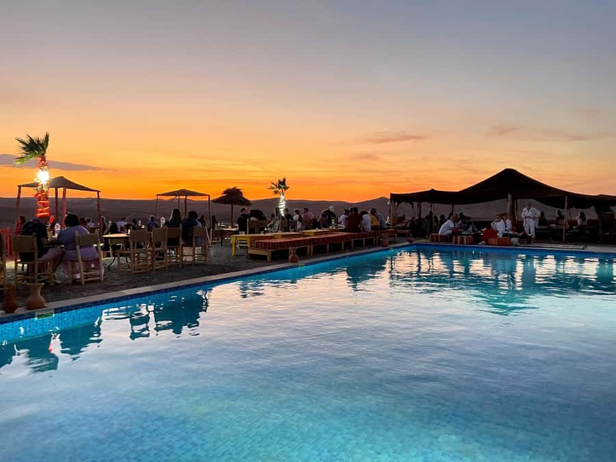 From Marrakesh: Sunset Dinner in Agafay at Berber Camp - Optional camel rides, pool, and stargazing