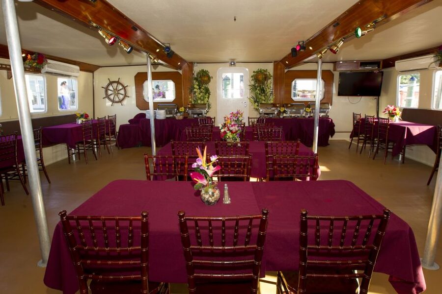 Key West: Sunset Dinner Cruise with Open Bar & Live Music - The first hour: harbor views and a tropical buffet