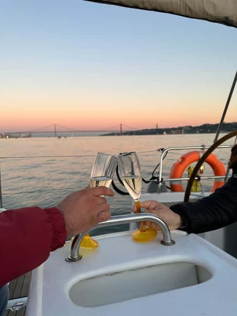 Lisbon: Romantic Cruise with Wine & Portuguese Tapas - Wine, tapas, and the sunset hour