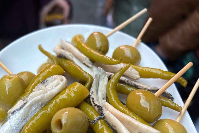 Madrid Local Tapas Tour with Private Dinner and Bottomless Wine - Key points at a glance