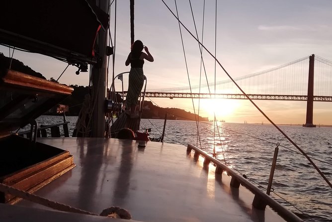 Marriage proposal on a Vintage Sailboat - Under the 25 de Abril Bridge