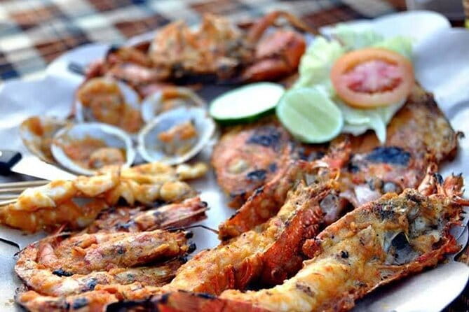 Romantic Seafood Dinner at Jimbaran Beach Bali include Sunset - Live music, waves, and a relaxed atmosphere