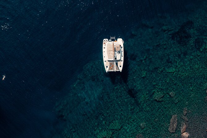 Romantic Sunset Catamaran Caldera Cruise incl. Meal & Drinks - White Beach, lunch, and time in the water