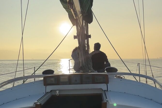 Romantic Sunset Sailing Experience in Lisbon - Sailing beneath the 25 de Abril Bridge