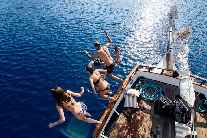 Santorini Sunset Dinner Cruise Including Nea Kameni Visit - Sailing past Santorini’s caldera cliffs