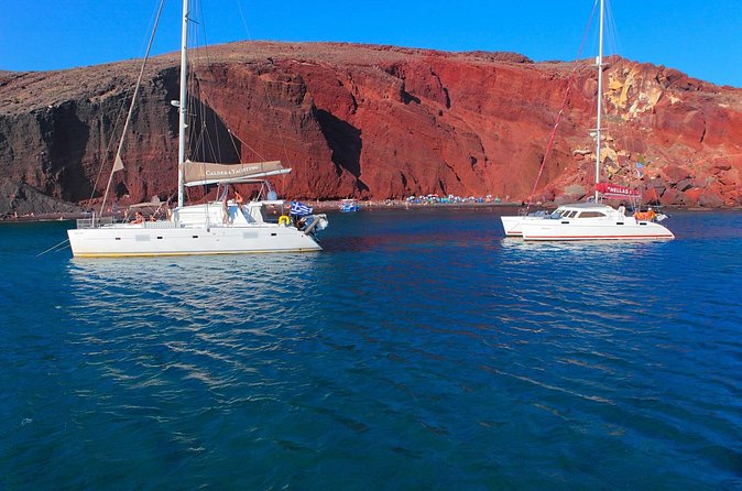 Shared Catamaran Romantic Sunset Cruise from Santorini via Volcano - Greek mezedes, barbecue, and drinks on board