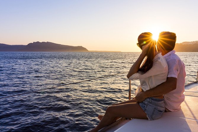 Shared Catamaran Romantic Sunset Cruise from Santorini via Volcano - White Beach and the first swim stop