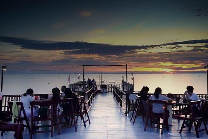 Sunset Dinner and drinks includes a Floating Village cruise tour. - Tonle Sap at twilight, with Cambodia on the water