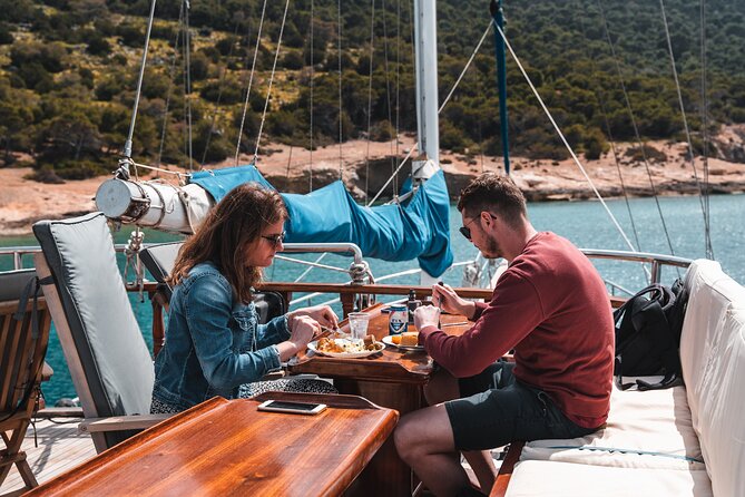 Sunset Dinner Cruise: Sunset, Swim, Drinks, and Dinner Onboard - Timing, weather, and cancellation details