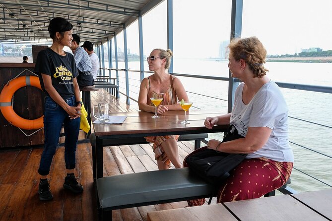 Sunset & Evening Dinner Cruise With One Way Free Pick Up - A sunset view of Phnom Penh from the river