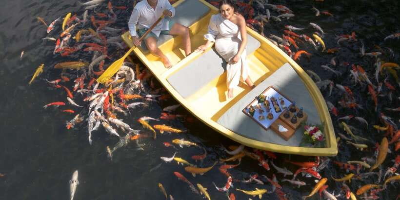 Ubud: The Original Koi Fish Yellow Boat Photo Moment - Sparkling wine and fish feeding