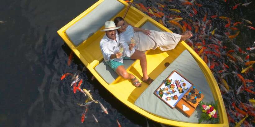 Ubud: The Original Koi Fish Yellow Boat Photo Moment - A good fit for anniversaries and birthdays