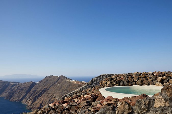 Volcanic Hot-Tub with Caldera View for Ultra-Romantic Couples - Cocktail, sparkling wine, and fruit